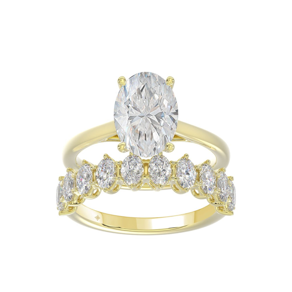 14K YELLOW GOLD 4 1/2CT ROUND/OVAL DIAMOND LADIES BRIDAL SET (CENTER STONE OVAL DIAMOND 3.00CT)